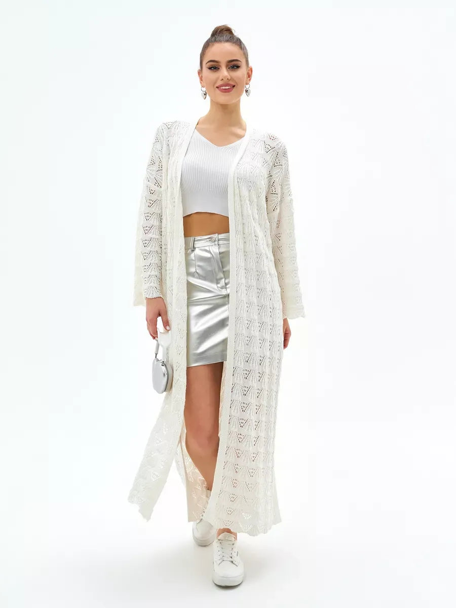 Model wearing a Pearl Cardigan by Lauven, showcasing its lightweight and stylish openwork design.