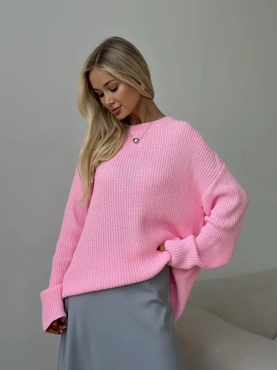Model wearing the Lauven Poppy Sweater, an oversized light pink knit with a crew neck and relaxed fit.