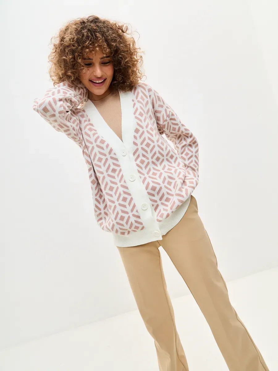 Powder Cardigan by Lauven, a stylish longline acrylic knitwear piece in milk and powder pink, featuring a relaxed fit.