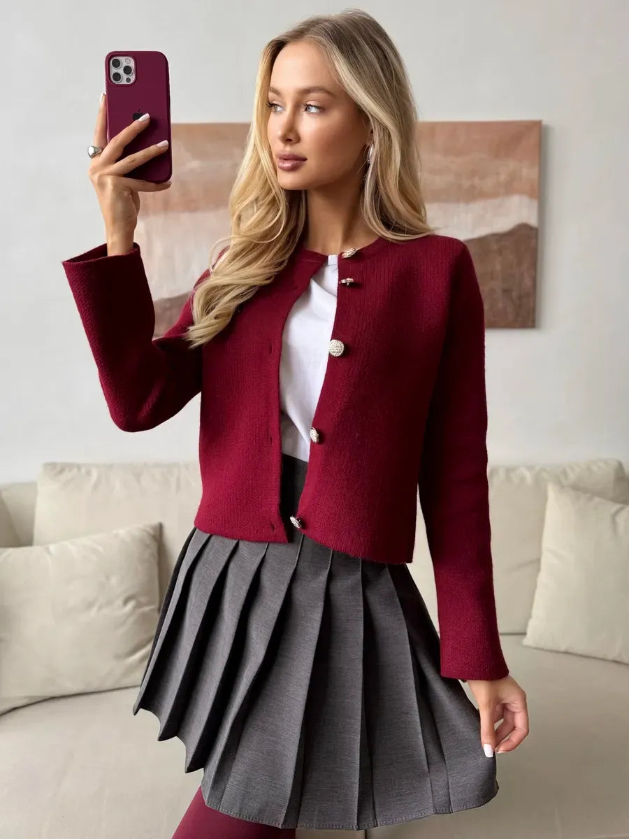 Roslyn Cardigan by Lauven in elegant burgundy, styled with a skirt, showcasing chic cropped knitwear for women.