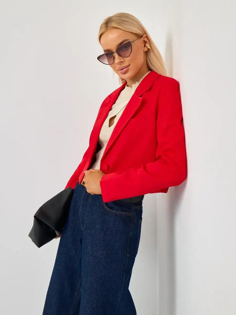 Ruby Blazer by Lauven featuring a cropped tailored red design, styled with wide-leg jeans and sunglasses.
