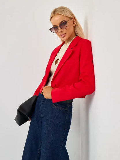 Ruby Blazer by Lauven featuring a cropped tailored red design, styled with wide-leg jeans and sunglasses.