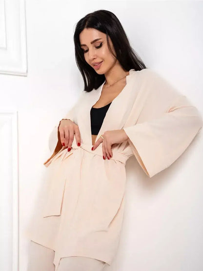 Model showcasing the Sahara Suit Set from Lauven, featuring a luxurious beige oversized design.