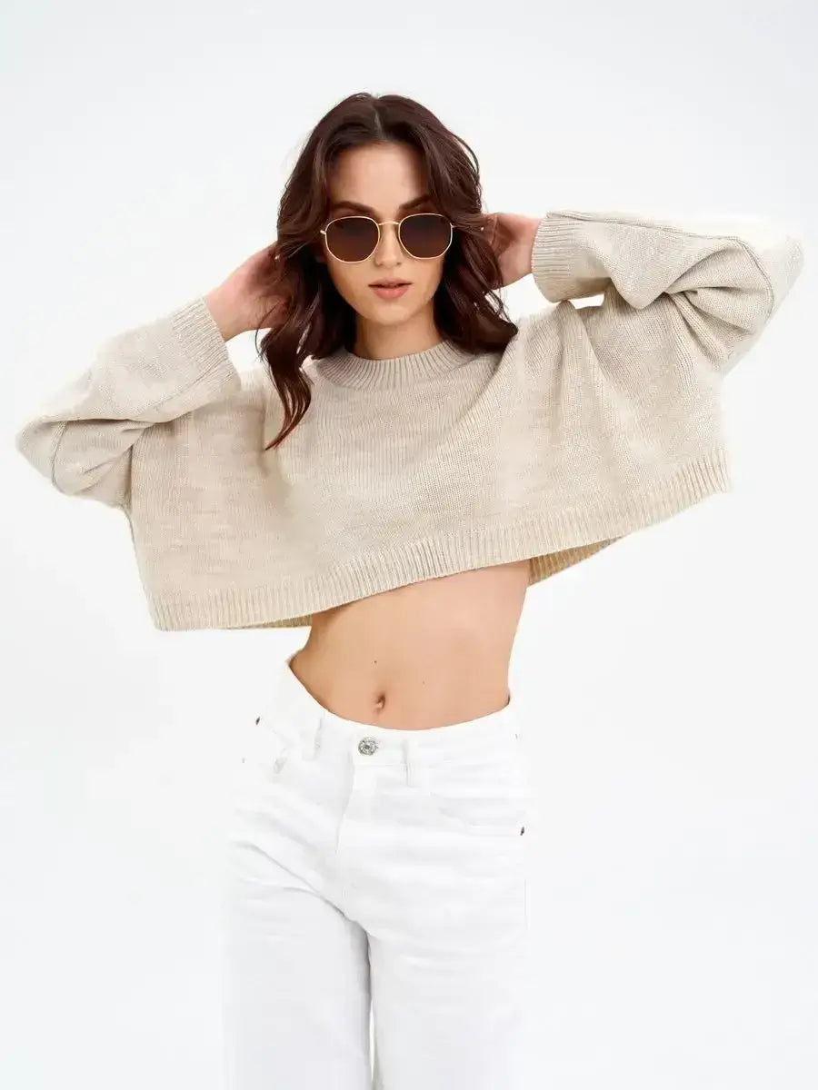 Cropped oversized Sand Sweater in light beige by Lauven, perfect for stylish layering and modern comfort.