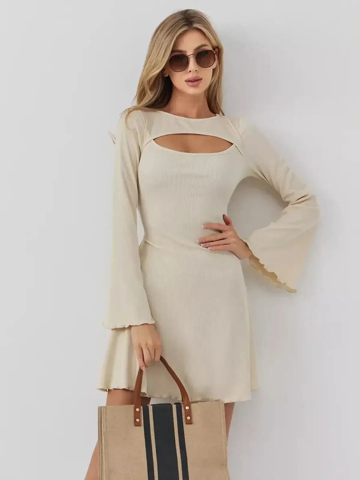 Sculpted Grace mini dress by Lauven, featuring a boat neckline, front cutout, and flared sleeves for elegant style.