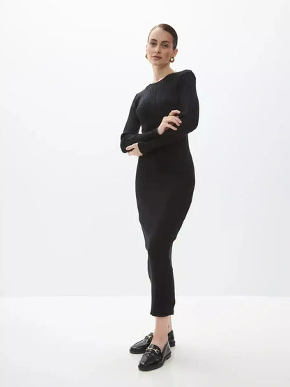 Model wearing Lauven Sculpted Rib Maxi Dress showcasing a streamlined silhouette and ribbed texture.