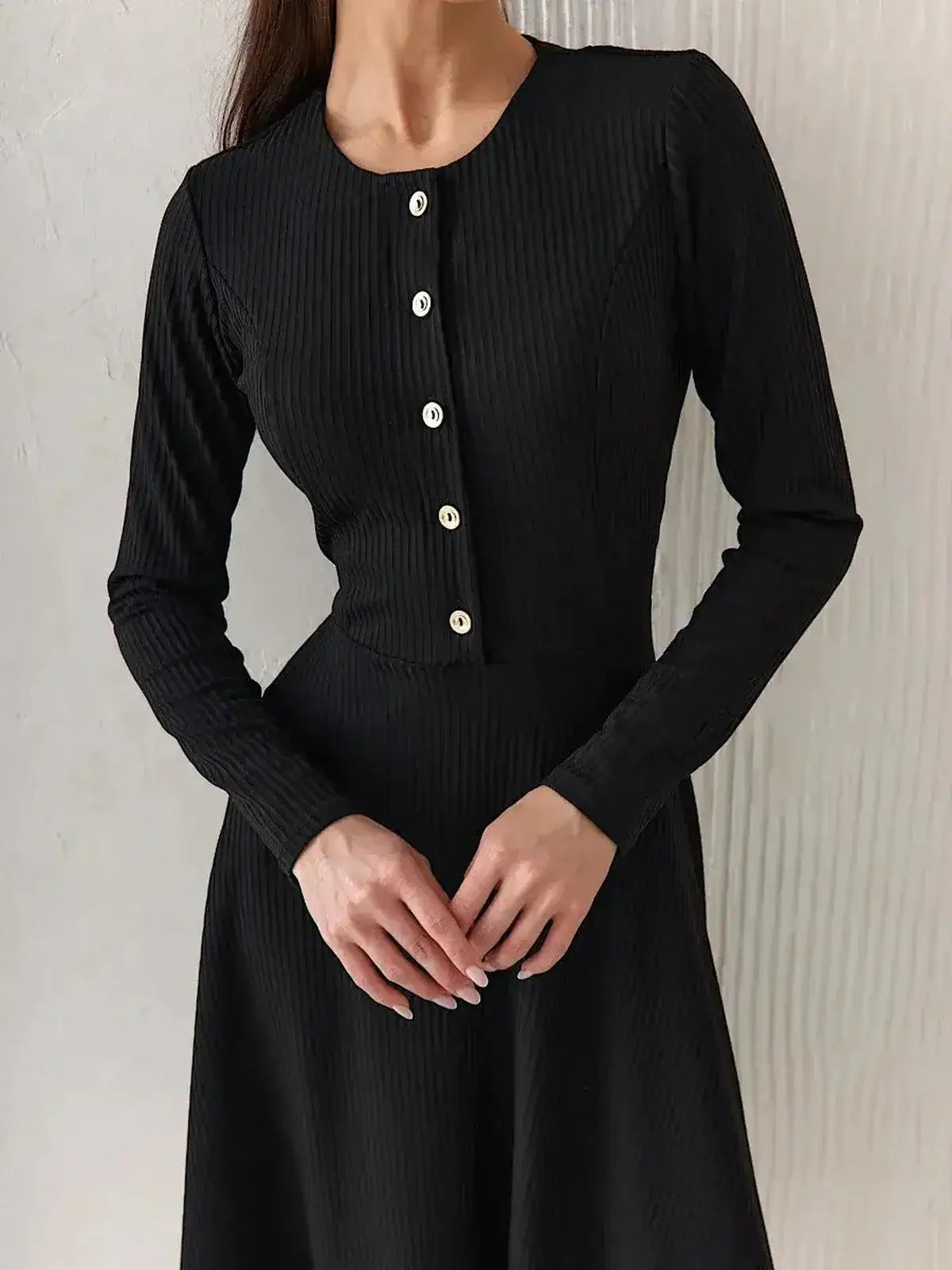 Serene Grace Midi Dress by Lauven featuring a black ribbed silhouette with decorative buttons and tailored bodice.