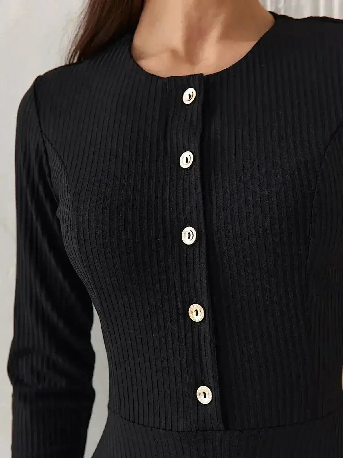 Serene Grace Midi Dress by Lauven featuring a black ribbed texture and decorative buttons for elegant style.