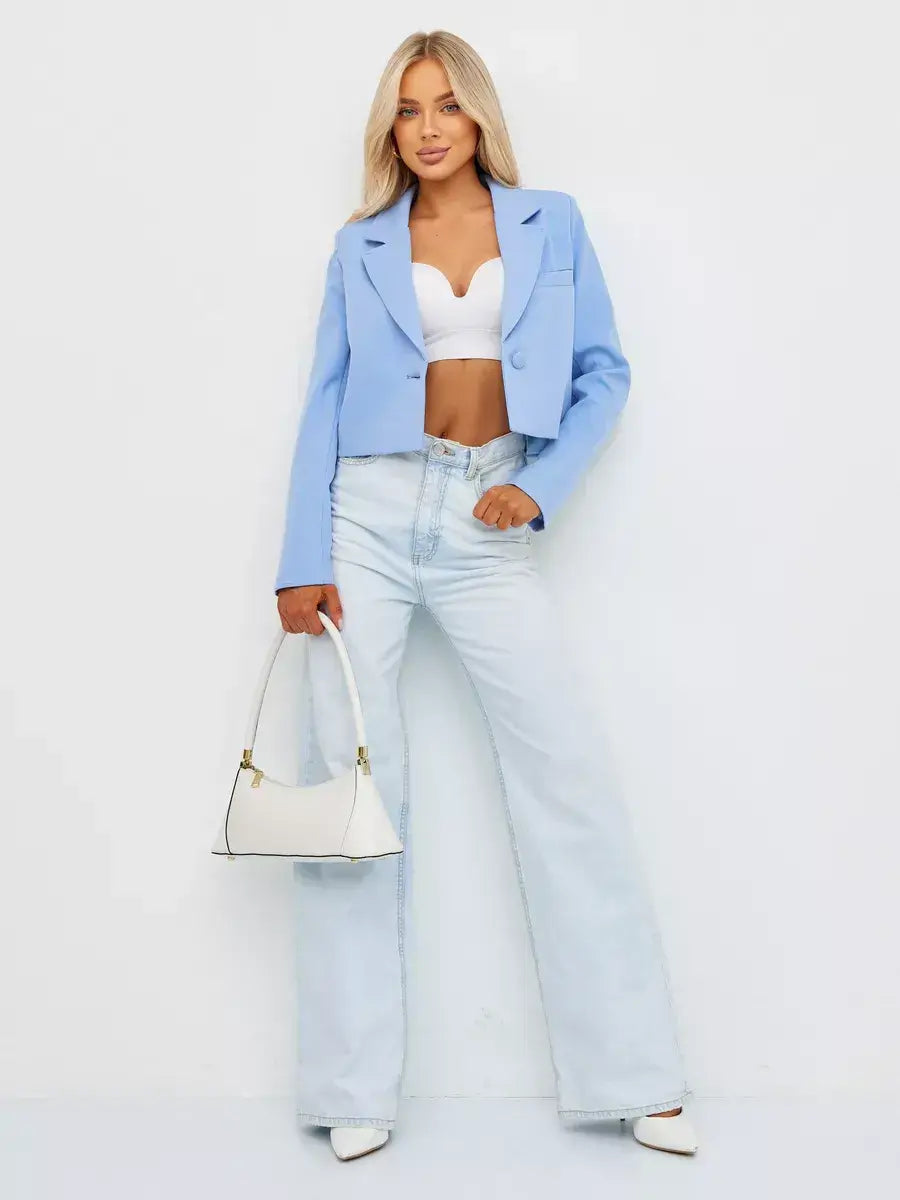 Skyline Blazer by Lauven in soft blue, styled with high-waisted jeans and a chic white bag for a modern look.
