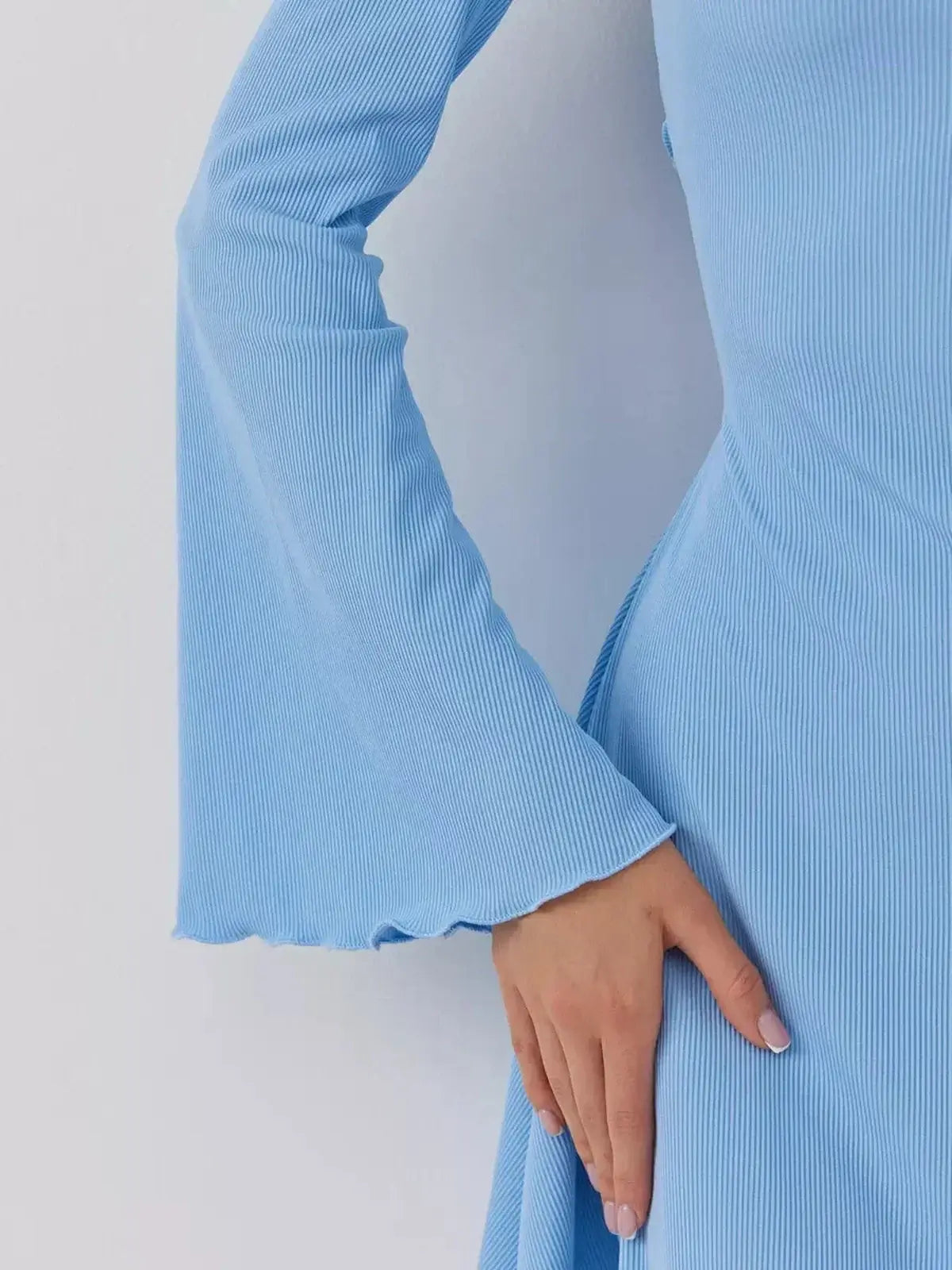 Close-up detail of the Skyline Cutout mini dress by Lauven in dreamy sky blue with flared sleeves.