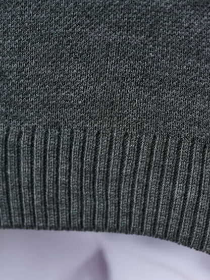 Slate Pullover by Lauven, showing the ribbed hem detail of an oversized cropped women’s sweater in dark gray.