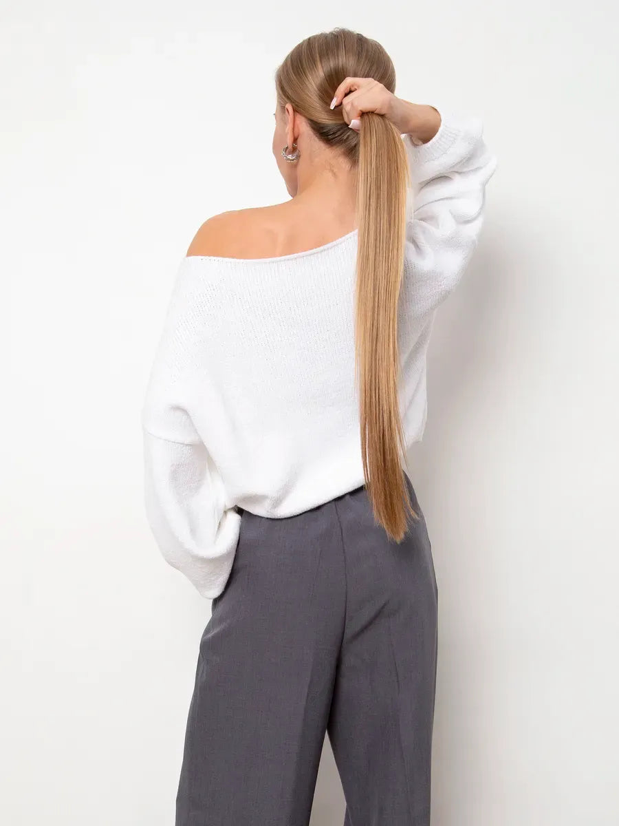 Back view of a model wearing the Snowfall Sweater from Lauven, showcasing its oversized design and boat neck.