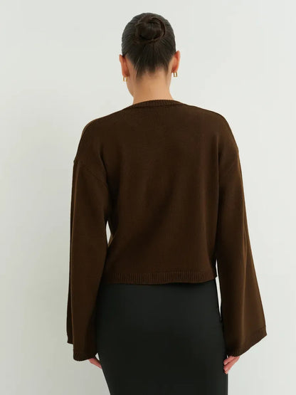 Umber Cardigan by Lauven, showcasing a cropped brown knit design with wide sleeves from the back.