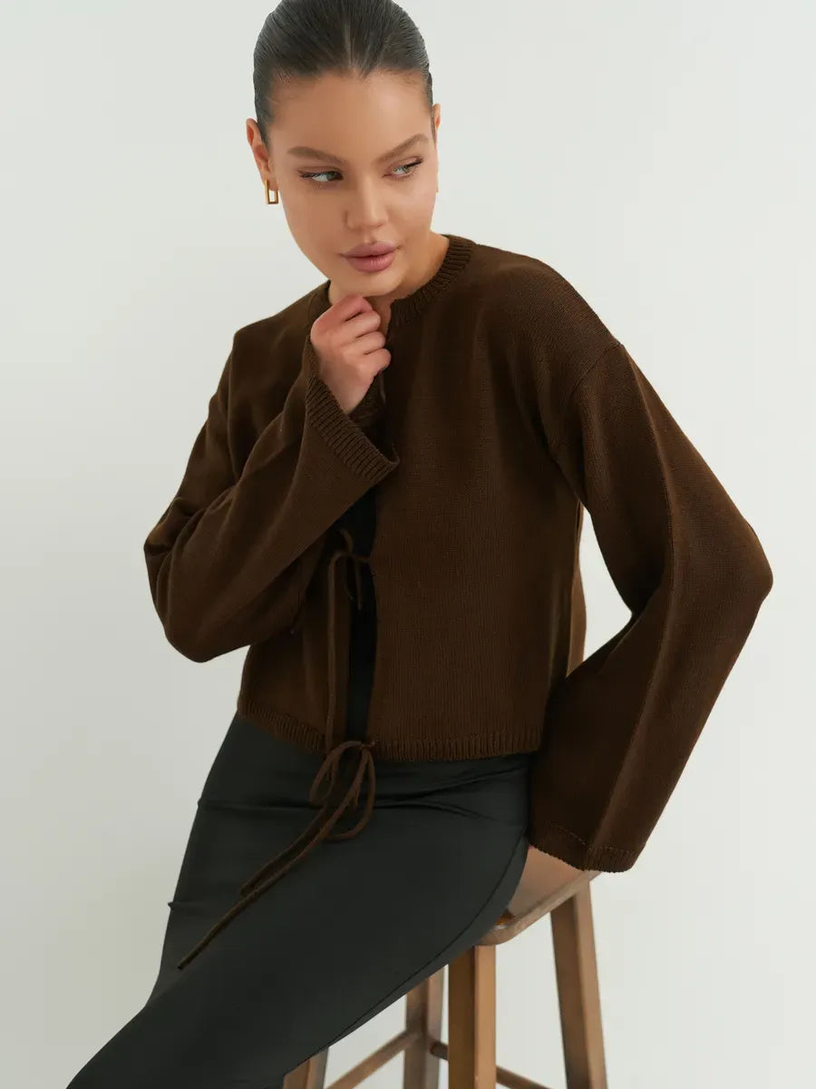 Umber Cardigan by Lauven features a cropped brown knit with tie-front detailing, perfect for effortless layering.