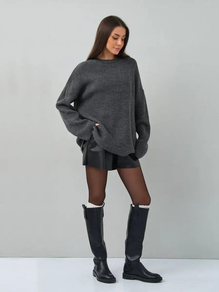 Model wearing Vera Sweater by Lauven, an oversized dark gray knit pullover for a stylish and cozy look.