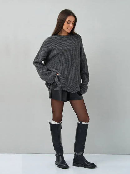 Model wearing Vera Sweater by Lauven, an oversized dark gray knit pullover for a stylish and cozy look.