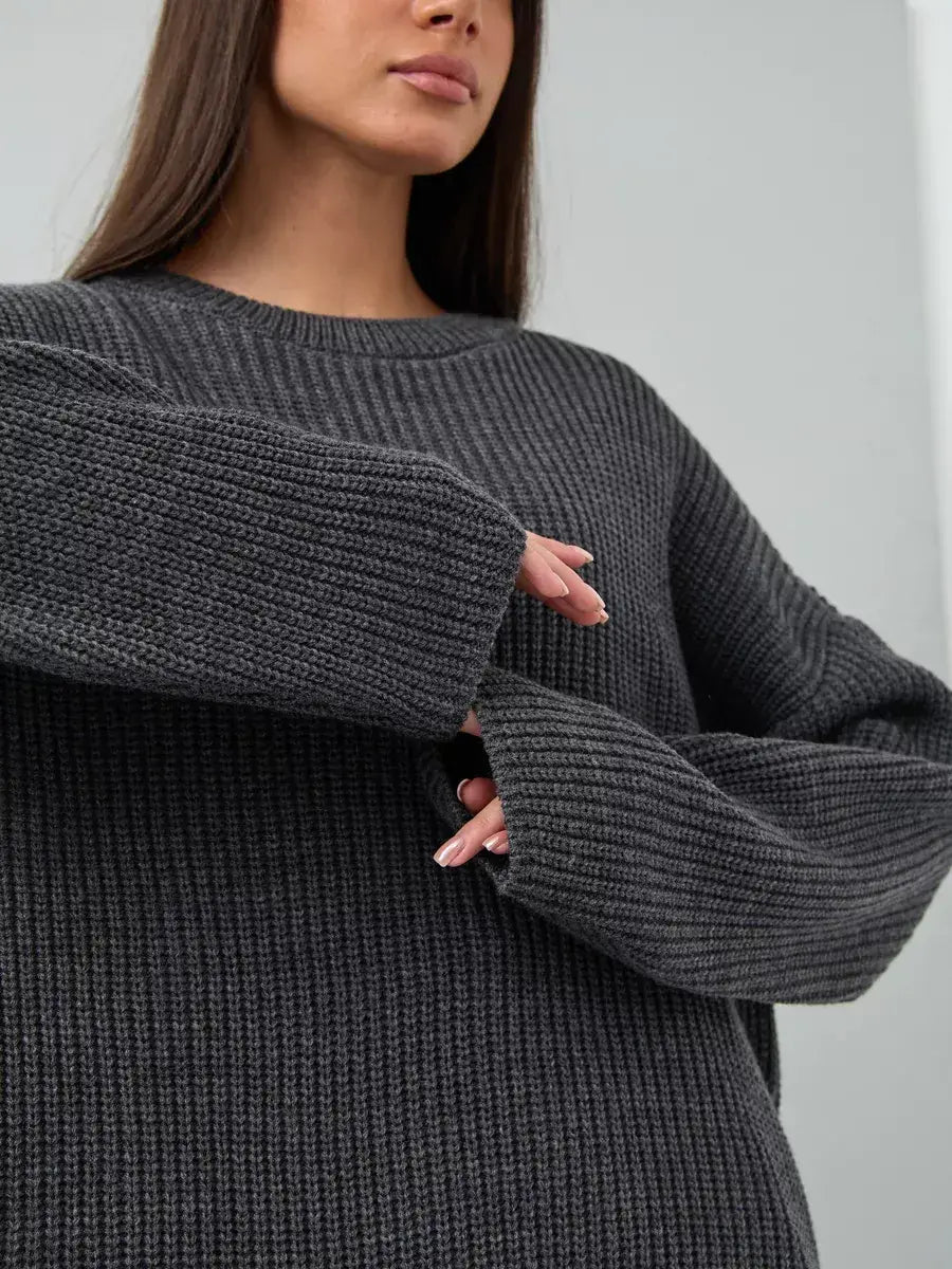 Vera Sweater by Lauven, oversized dark gray knit pullover with crew neck and chunky ribbed texture.