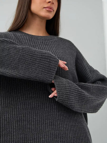 Vera Sweater by Lauven, oversized dark gray knit pullover with crew neck and chunky ribbed texture.