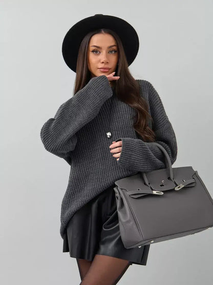 Vera Sweater by Lauven, oversized dark gray knit with crew neck, paired with a stylish black skirt and hat.
