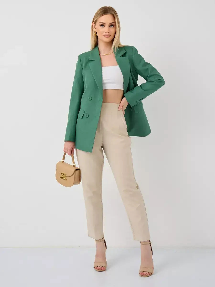 Model showcasing the Verde Blazer by Lauven, an oversized double-breasted green tailored jacket.