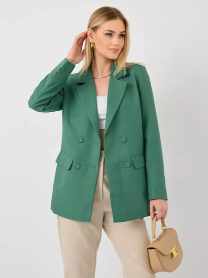 Model showcasing the Verde Blazer by Lauven, an oversized green tailored double-breasted jacket.