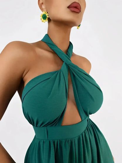 Close-up of Verona Jumpsuit by Lauven, featuring twisted halter neckline and rich emerald fabric.