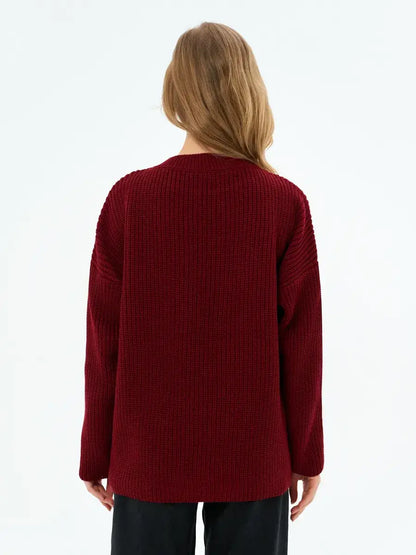 Back view of the Verona Sweater by Lauven in deep burgundy, showcasing its oversized knit design.