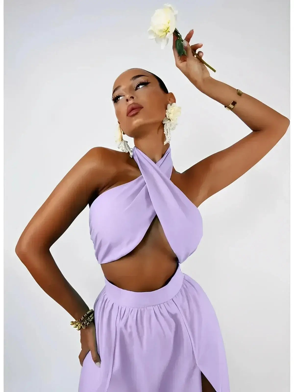 Model wearing the Lavender Breeze Set by Lauven, featuring a halter top and a high-slit maxi skirt in lavender.