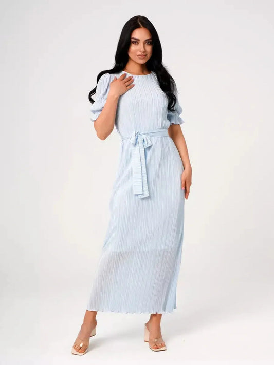 Celeste Flow Maxi Dress in light blue, featuring pleats, puff sleeves, and self-tie waistbelt, perfect for summer events.