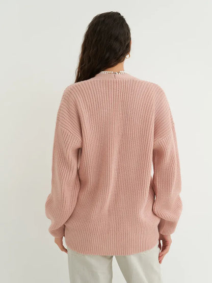 Back view of the Liora Cardigan in soft powder pink, showcasing the textured knit and oversized fit by Lauven.