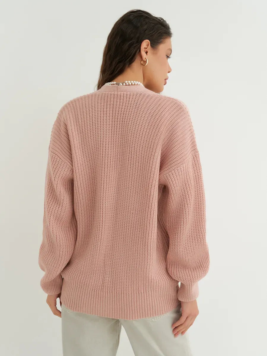 Liora Cardigan by Lauven in soft powder pink, showcasing oversized knitwear design from the back.
