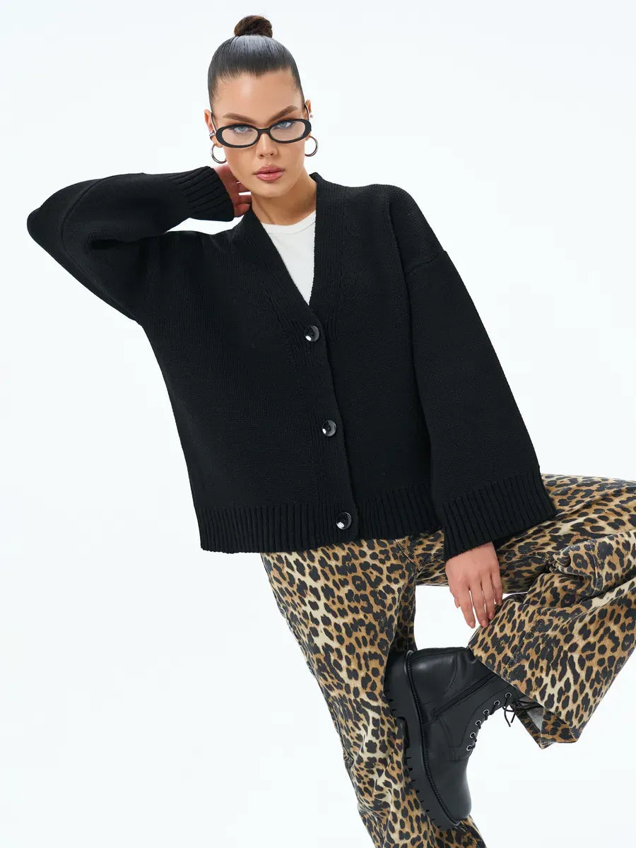 Luna Cardigan by Lauven, cozy oversized knitwear with button closure in black, styled with trendy leopard-print pants.