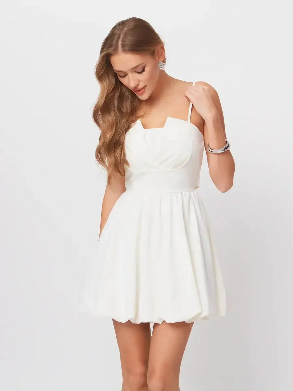 Luna Mini Dress in white with adjustable straps and A-line silhouette, perfect for summer parties or graduations.