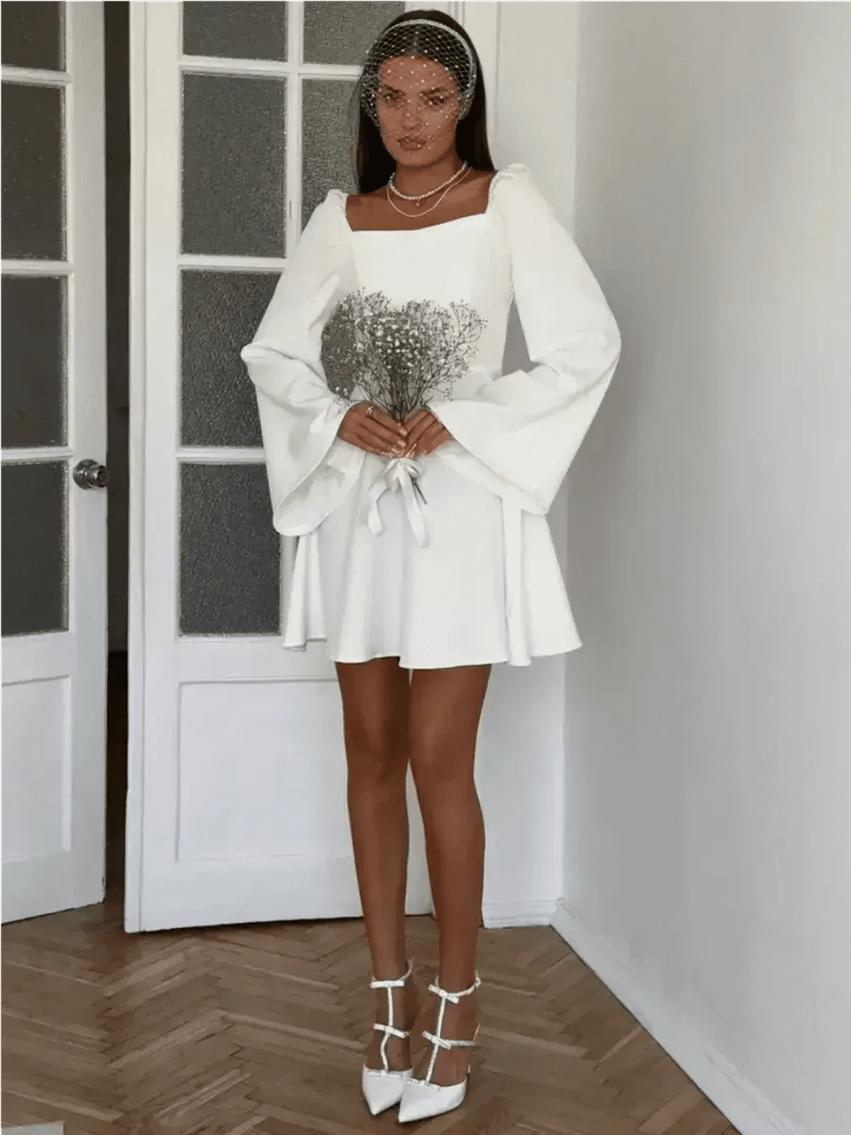 Luna Whisper white mini dress with voluminous sleeves, perfect for weddings, graduation, and formal occasions.