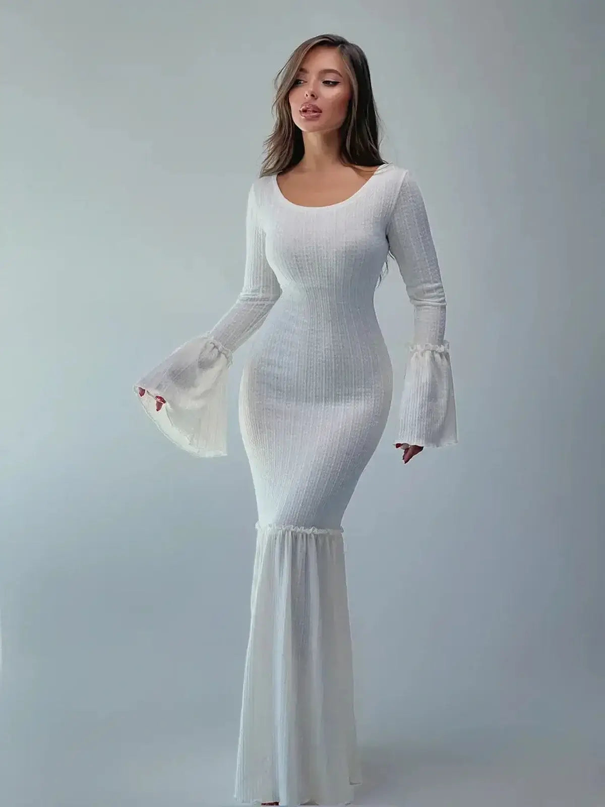 Lustre Maxi Dress featuring a sculpted knit silhouette and dramatic bell sleeves in elegant white.