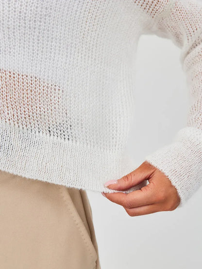 Luxe Cardigan in soft ivory showcasing semi-transparent knit, perfect for chic, comfortable looks by Lauven.