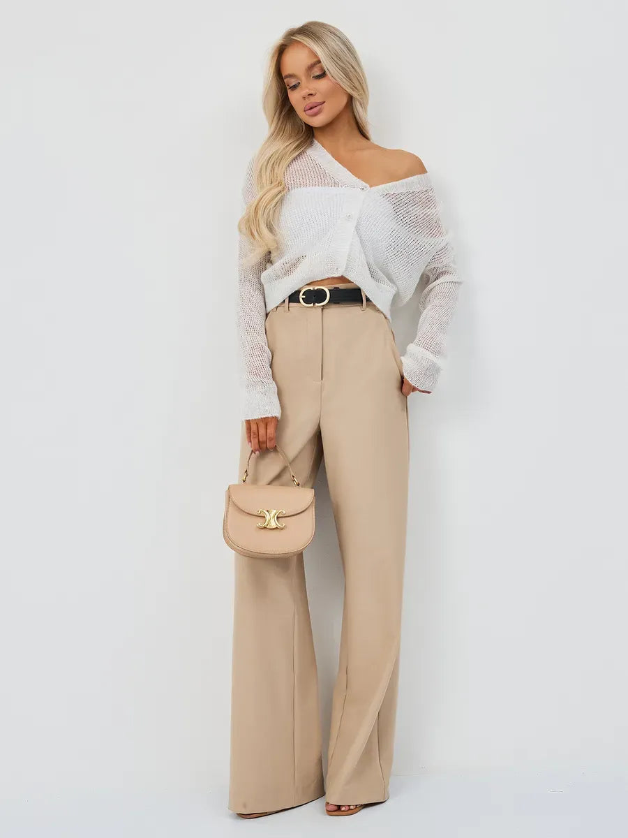Luxe Cardigan by Lauven styled with wide-leg trousers and a chic handbag for a sophisticated look.