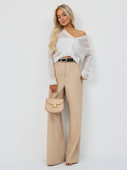 Luxe Cardigan by Lauven styled with wide-leg trousers and a chic handbag for a sophisticated look.