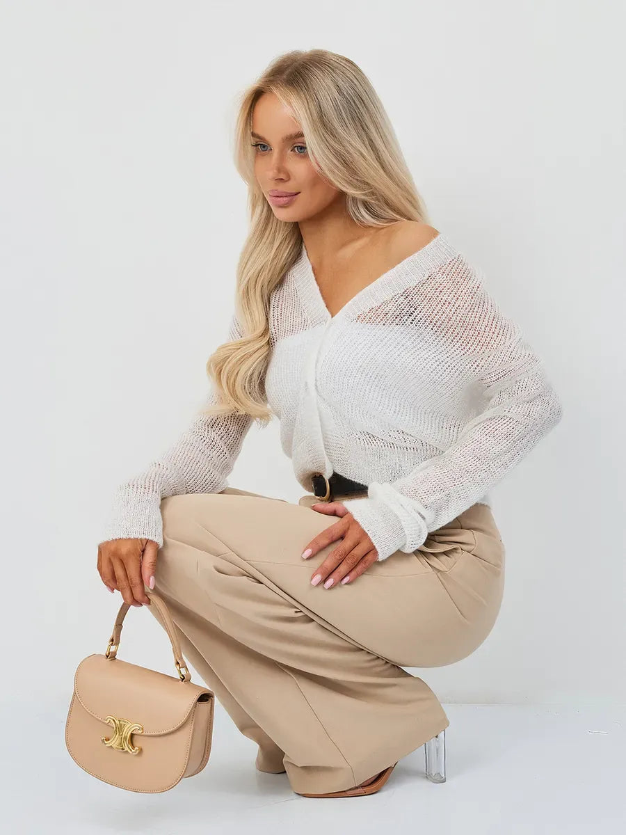 Model wearing Luxe Cardigan by Lauven, an oversized mohair-blend knitwear in soft ivory.