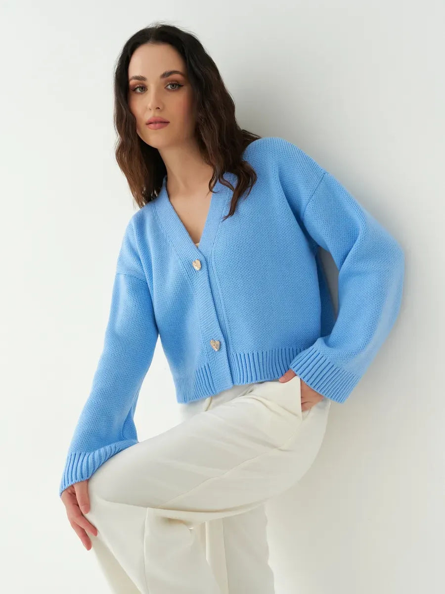 Lyra Cardigan by Lauven, cropped blue knit with heart buttons, perfect for modern feminine style.