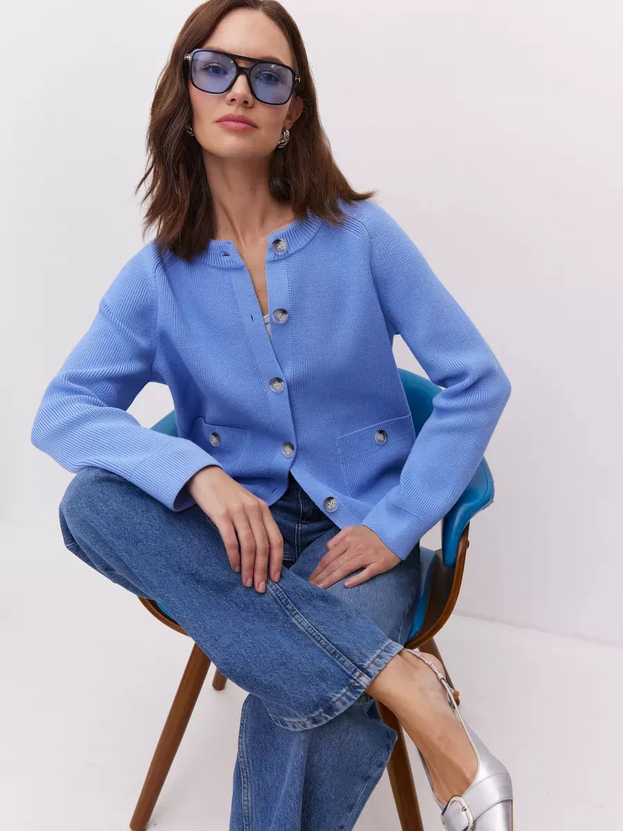 Lyra Cardigan by Lauven in soft blue, showcasing a button-up knit design with modern elegance.