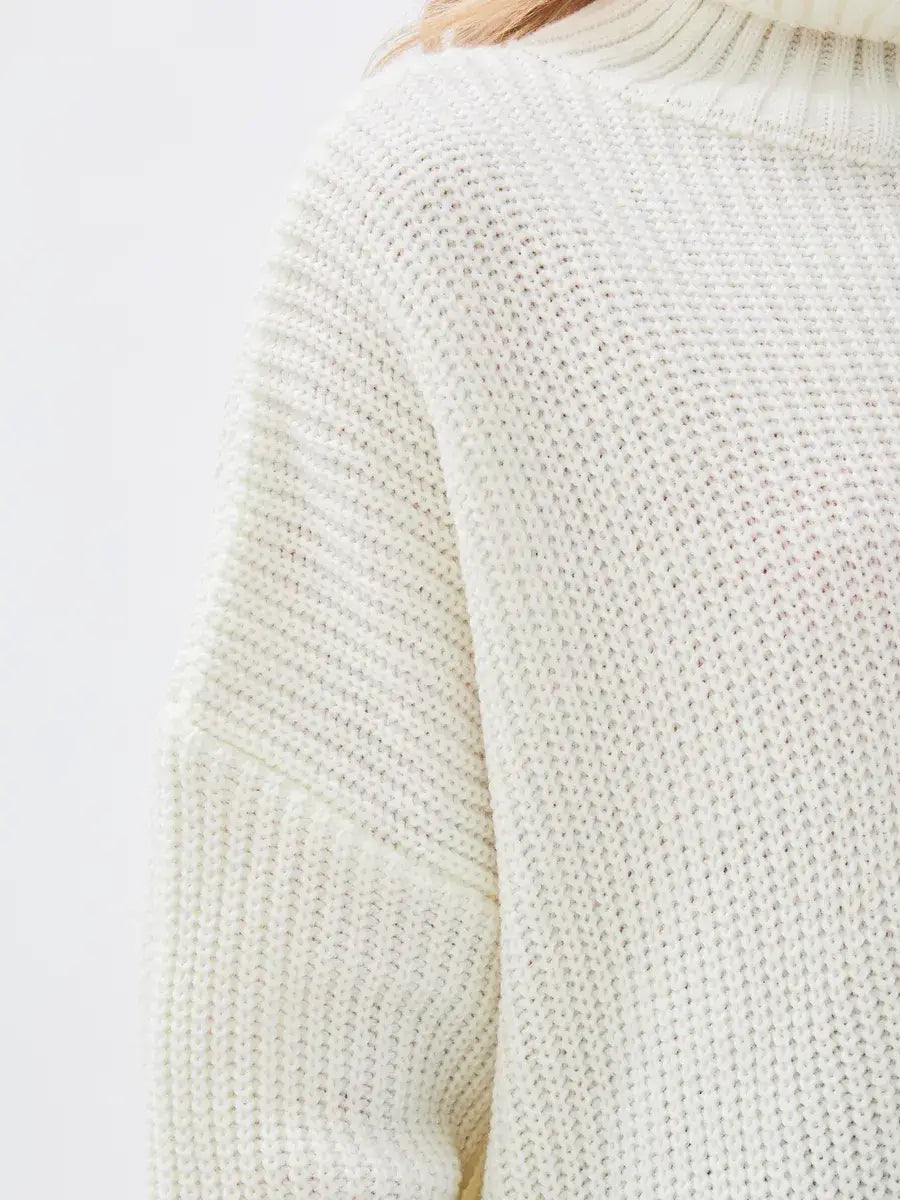 Lyra Sweater by Lauven, oversized knit in ivory with high neck, offering elegance and comfort.