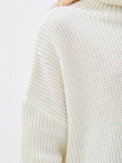Lyra Sweater by Lauven, oversized knit in ivory with high neck, offering elegance and comfort.