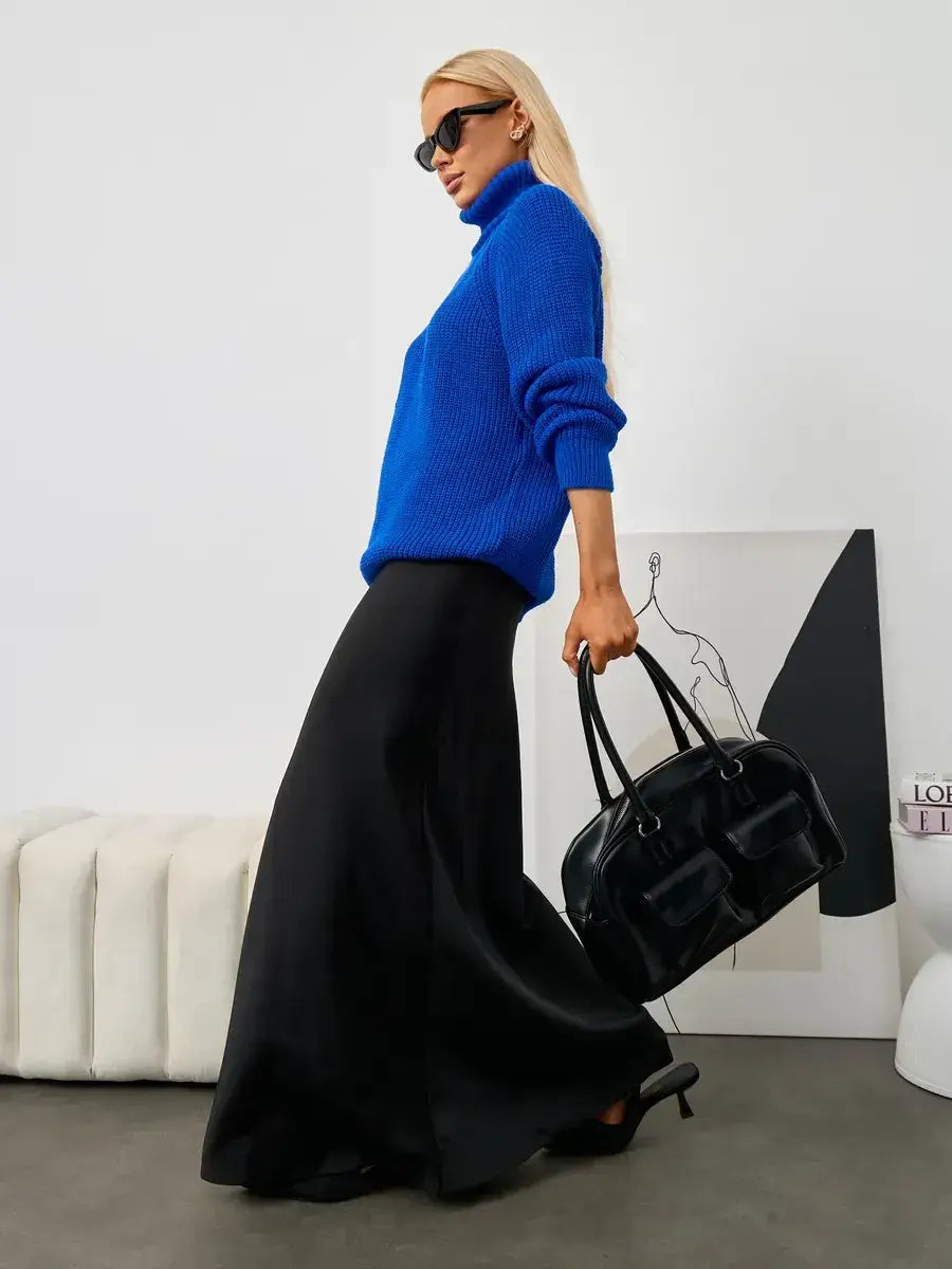Lyra Sweater by Lauven in blue worn with a long black skirt, showcasing turtleneck elegance and relaxed fit.