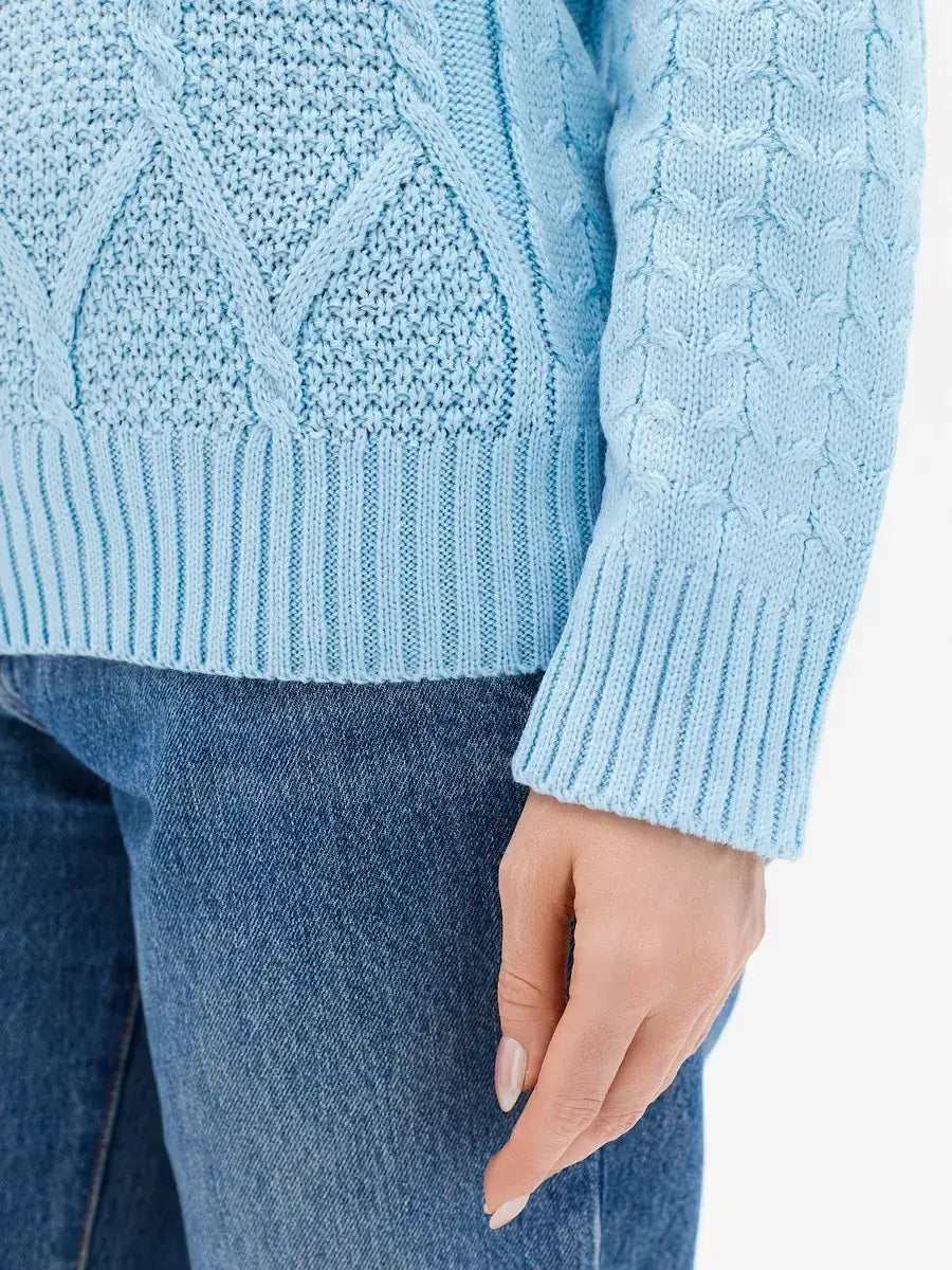 Lyra Sweater by Lauven, showcasing light blue cable knit details and comfort for modern women.