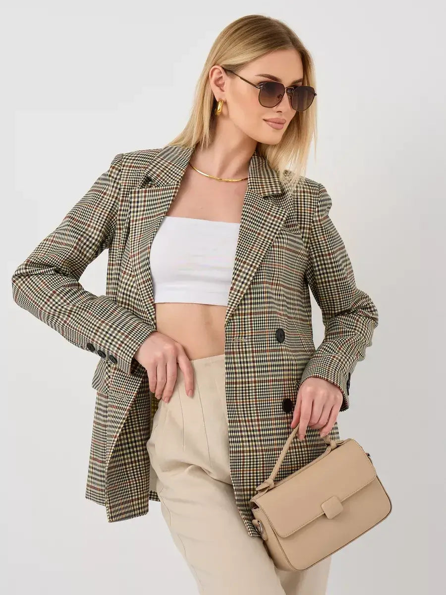 Model wearing Maple Blazer by Lauven, an elegant oversized brown checked women's blazer, styled with sunglasses.