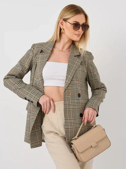 Model wearing Maple Blazer by Lauven, an elegant oversized brown checked women's blazer, styled with sunglasses.