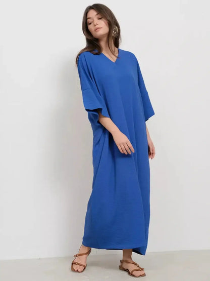 Maxi Dress Azure Flow in vibrant blue, featuring a V-neckline and relaxed silhouette for effortless elegance.