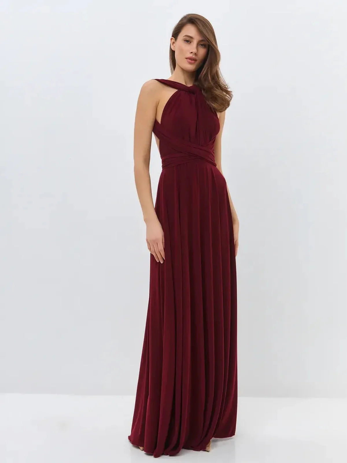 Elegant backless Bordeaux Muse maxi dress featuring a convertible silhouette in a deep wine hue.