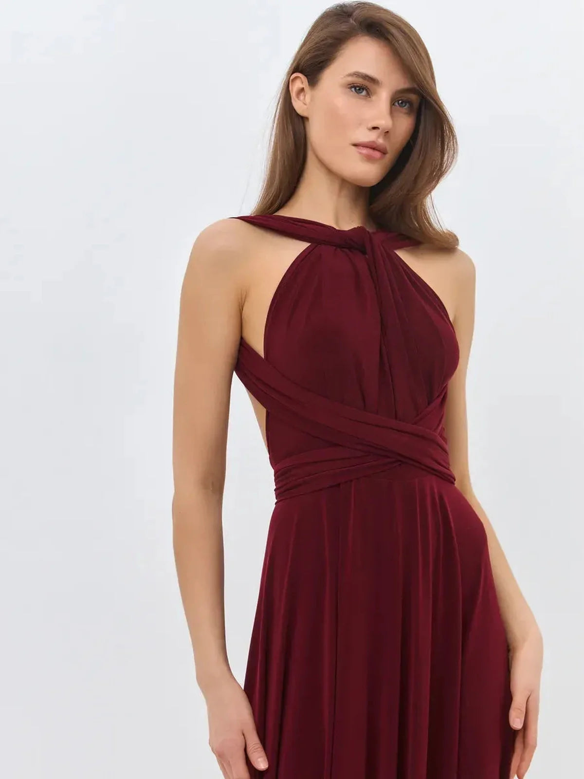 Elegant Bordeaux Muse maxi dress featuring a convertible silhouette and backless design, perfect for formal events.